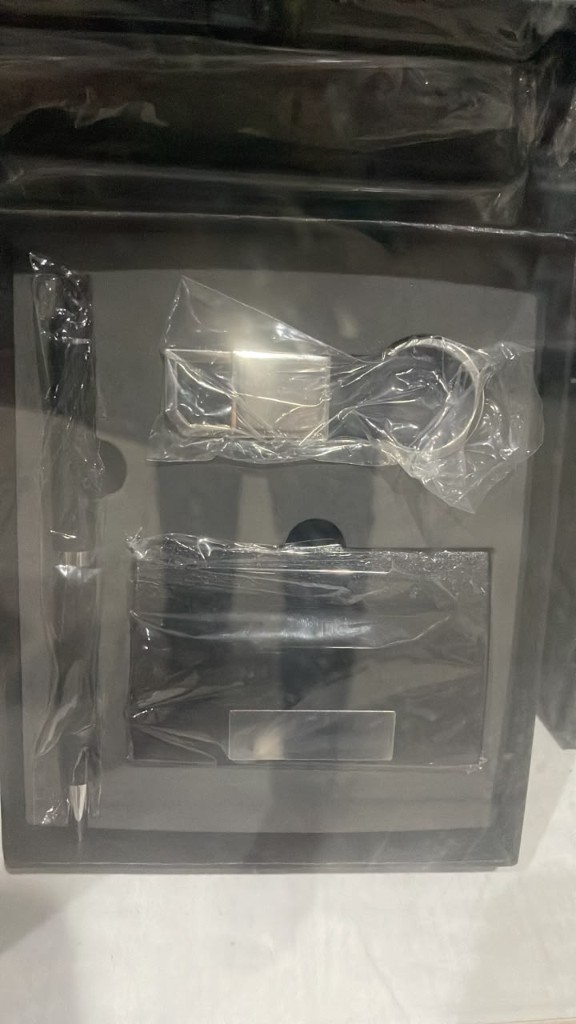 Black pen, keychain, and cardholder gift set
