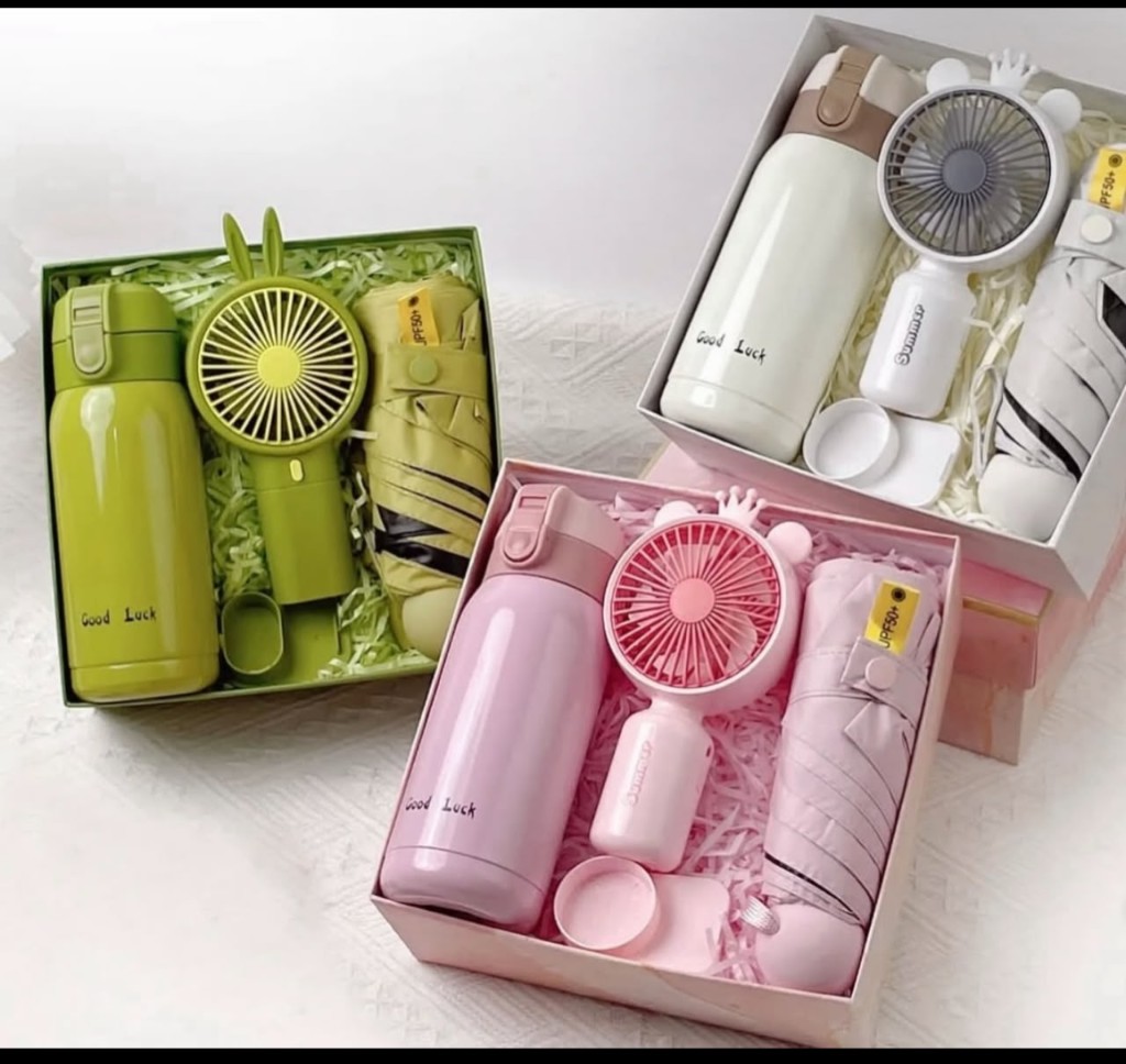 Summer care gift sets in green, pink, and cream with bottle, fan, and umbrella