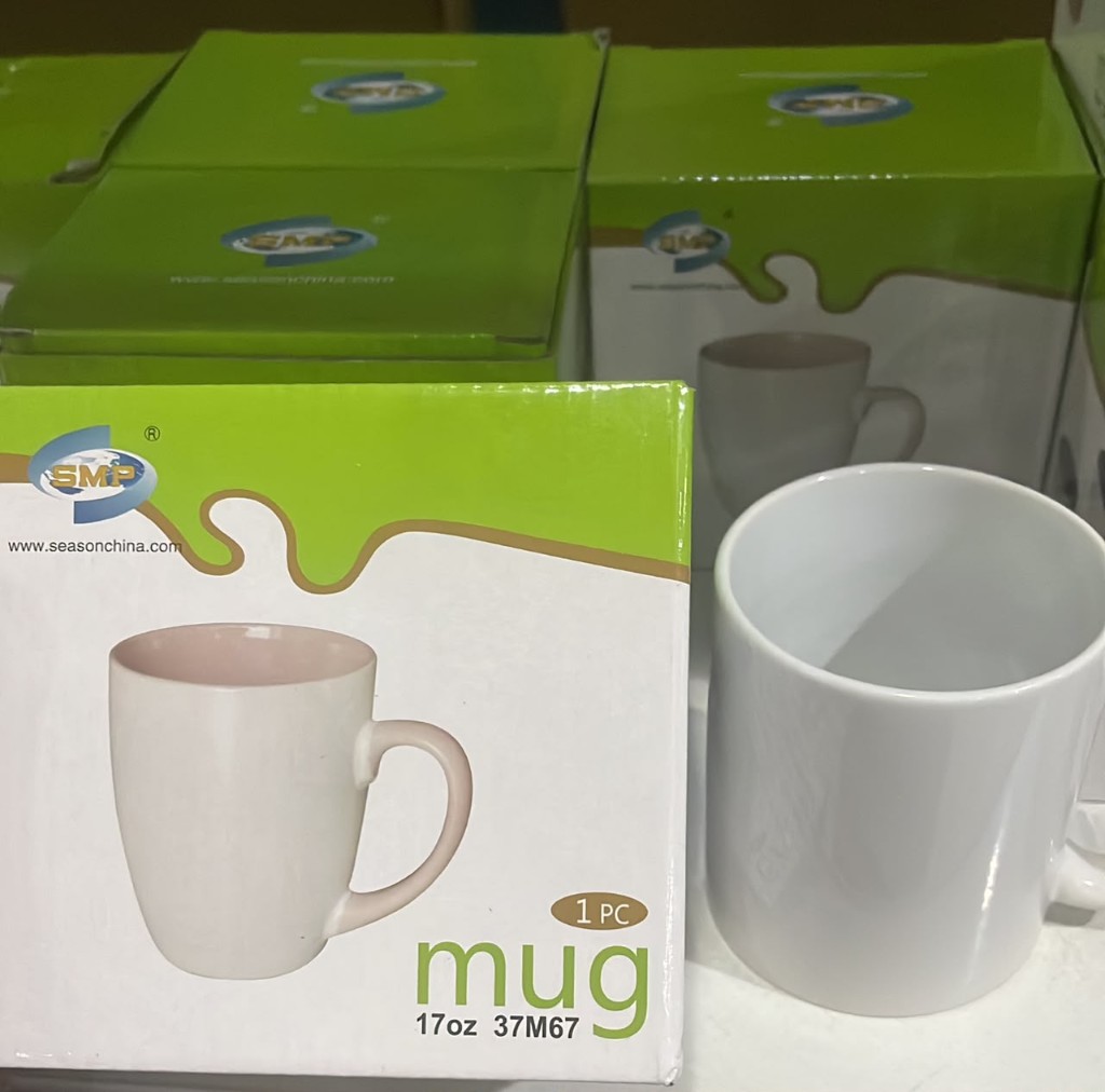 Large white ceramic mug with retail packaging